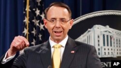 Deputy Attorney General Rod Rosenstein announces that a grand jury has charged 13 Russian nationals and several Russian entities, Feb. 16, 2018, in Washington. The defendants are accused of violating U.S. criminal laws to interfere with American elections and the political process.