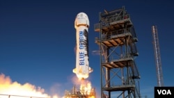 Blue Origin's New Shepard booster makes another successful launch and landing from the company's West Texas launch facility. (Blue Origin)