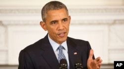 President Barack Obama gestures as he answers question from members of the media during a news conference in the State Dining Room of the White House in Washington, Oct. 2, 2015.