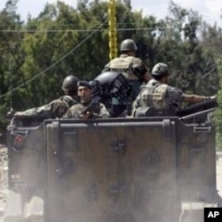 Lebanese security forces patrol an area in the north Lebanese town of Wadi Khaled on the border with Syria as Syria's unrest following anti-regime protests entered a third month, May 15, 2011