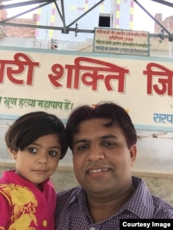 A selfie of Sunil Jaglan head of Bibipur village, with his 3 1/2 year-old daughter -- the first photo in the SelfieWithDaughter campaign (Courtesy Image/Sunil Jaglan).