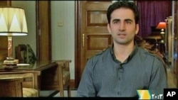 Iranian-American Amir Mirza Hekmati, who has been sentenced to death by Iran's Revolutionary Court on the charge of spying for the CIA, speaks during a recorded interview in an undisclosed location, in this undated still image taken from video by Reuters 