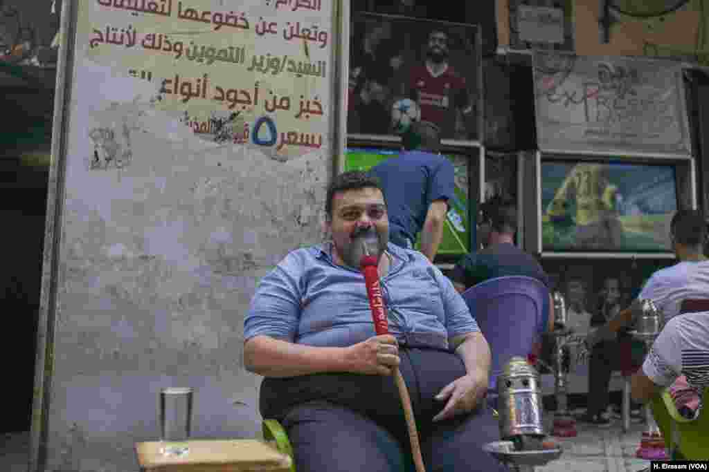 Adel, 42, enjoys a smoke as his country’s team loses its third and final match in the World Cup 2018 in Russia.