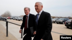 Secretary of Defense James Mattis greets Ambassador John Bolton (L), President Donald Trump's nominee to be National Security Advisor, as he arrives at the Pentagon in Washington, U.S., March 29, 2018.