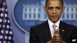 President Barack Obama takes questions from reporters at the White House on December 19, 2012.