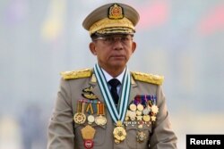 FILE -Myanmar's junta chief Senior General Min Aung Hlaing presides at an army parade on Armed Forces Day in Naypyitaw, Myanmar, March 27, 2021.