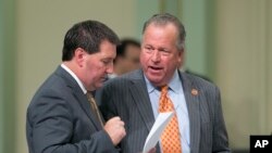 In this file photo, California State Sen. Bill Dodd, D-Napa, right, discusses his media literacy measure before the Assembly with Assemblyman Tim Grayson, D-Concord, Aug. 31, 2017, in Sacramento.