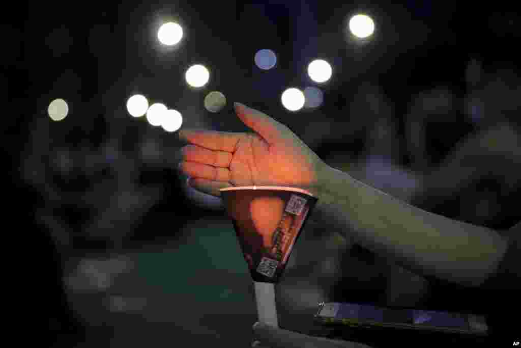 An activist holds a candle during a ceremony for the victims of the 1989 Tiananmen Square Massacre. Permission for the gathering, held at Hong Kong&#39;s Victoria Park in Causeway Bay, was officially denied.&nbsp;