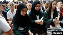 Students gather in a vigil to commemorate victims of Friday's shooting, outside Masjid Al Noor mosque in Christchurch, New Zealand March 18, 2019.