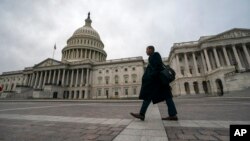 FILE - The Capitol is seen as the partial government shutdown lurches into a third week with President Donald Trump standing firm in his border wall funding demands, in Washington, Jan. 7, 2019. 