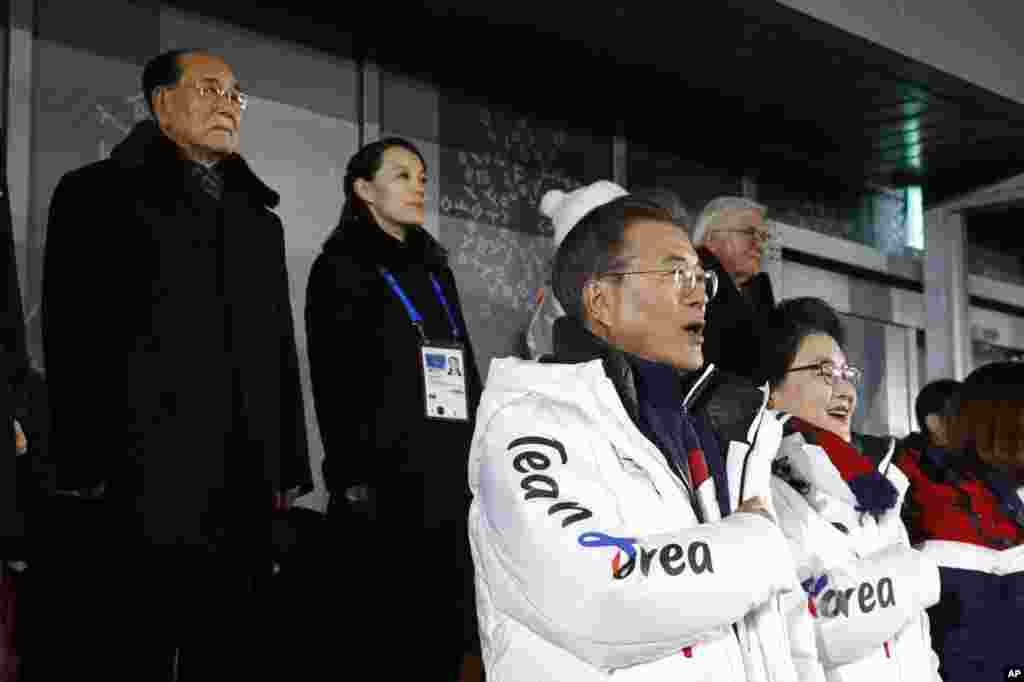 South Korean President Moon Jae-in, second from bottom right, stands alongside first lady Kim Jung-sook as the South Korean national anthem is played at the opening ceremony of the 2018 Winter Olympics in Pyeongchang, South Korea, Feb. 9, 2018.