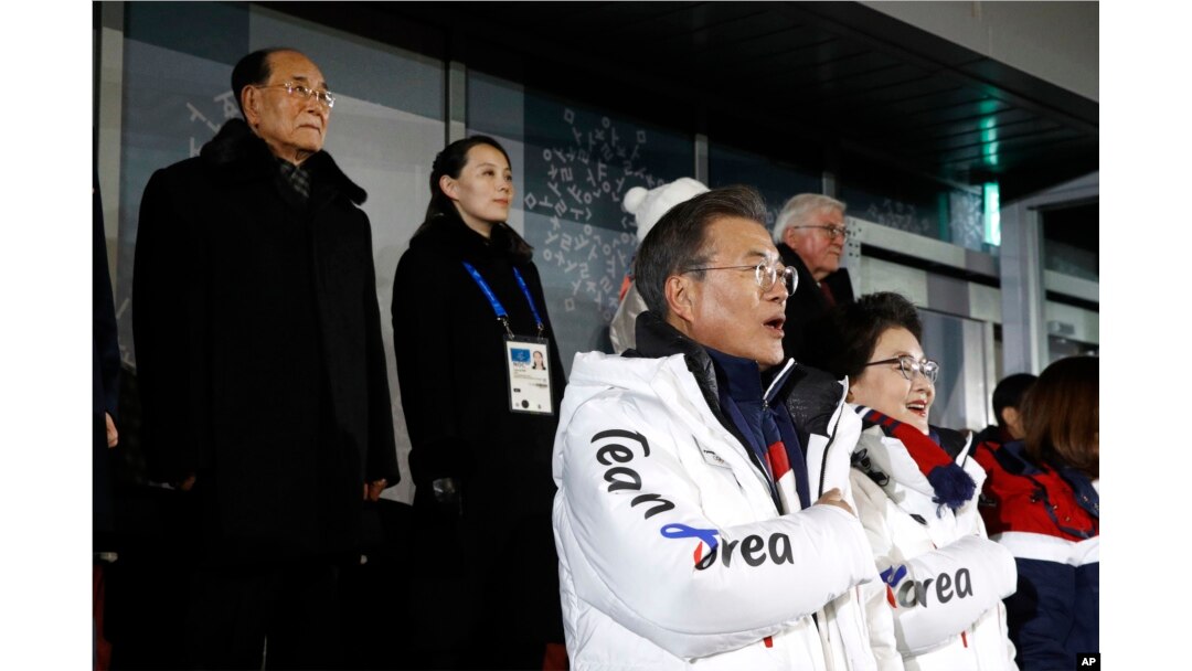 South Korean President Moon Jae-in, second from bottom right, stands alongside first lady Kim Jung-sook as the South Korean national anthem is played at the opening ceremony of the 2018 Winter Olympics in Pyeongchang, South Korea, Feb. 9, 2018.