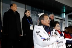 South Korean President Moon Jae-in, second from bottom right, stands alongside first lady Kim Jung-sook as the South Korean national anthem is played at the opening ceremony of the 2018 Winter Olympics in Pyeongchang, South Korea, Feb. 9, 2018.