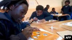 FILE - Schoolchildren attend classes at the Sacred Heart College in Johannesburg.