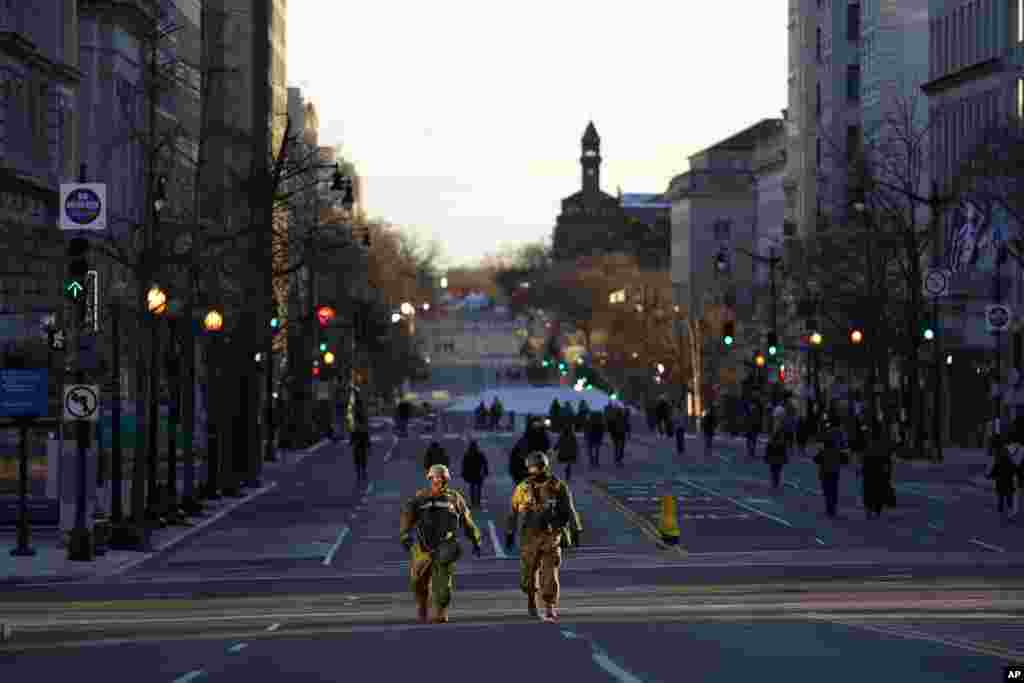 National Guards patrol empty streets ahead of President-elect Joe Biden&#39;s inauguration ceremony, Tuesday, Jan. 19, 2021, in Washington. (AP Photo/Matt Slocum)