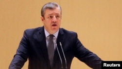 Georgy Kvirikashvili delivers a speech to members of parliamentary groups and committees in Kutaisi, Georgia, Dec. 28, 2015.