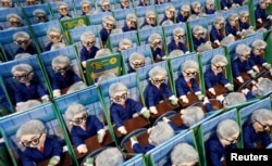 Dolls of Berkshire Hathaway CEO Warren Buffett are sale at the shareholder shopping day as part of the Berkshire Hathaway annual meeting weekend in Omaha, Neb., May 5, 2017.