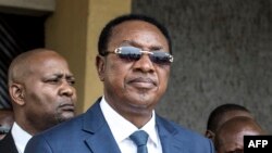  Le Premier ministre de la République démocratique du Congo, Bruno Tshibala (C) au sortir d'une messe de célébration du 17e anniversaire de l'assassinat de Laurent-Désiré Kabila, à Kinshasa, le 16 janvier 2018