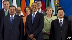 President Barack Obama takes his place with other leaders for the Family Photo during the G20 Summit, Monday, June 18, 2012, in Los Cabos, Mexico. 