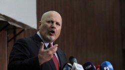FILE - International Criminal Court chief prosecutor Karim Ahmed Khan speaks during a news conference at the Ministry of Justice in the Khartoum, Sudan, Aug. 12, 2021