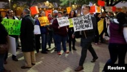 FILE - Protesters rally against white nationalist leader Richard Spencer of the National Policy Institute, who spoke at an event not sanctioned by the school, at Texas A&M University in College Station, Texas, Dec. 6, 2016.