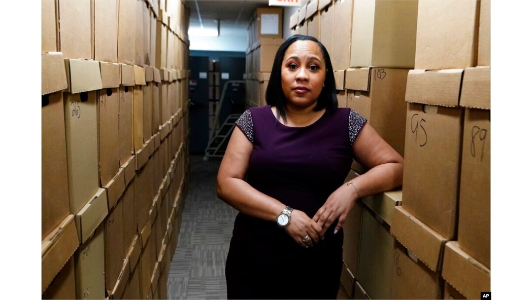 FILE - Fulton County District Attorney Fani Willis is seen at her office, in Atlanta, Feb. 24, 2021.