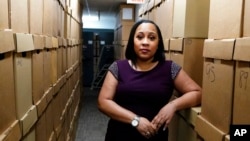 FILE - Fulton County (Ga.) District Attorney Fani Willis is seen at her office, in Atlanta, Feb. 24, 2021. Fani Willis has been investigating Donald Trump's role in trying to overturn his 2020 election loss to Joe Biden in her state. Charges could be brought soon.