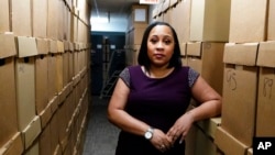 FILE - Fulton County District Attorney Fani Willis is seen at her office, in Atlanta, Georgia, Feb. 24, 2021.