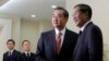 Chinese Foreign Minister Wang Yi (2nd R), shakes hands with Cambodia's Prime Minister Hun Sen before a meeting in Phnom Penh, Aug. 21, 2013. 