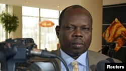 FILE - Pagan Amum, pictured speaking to reporters in Addis Ababa, May 31, 2012, says his South Sudan Reborn plan is aimed at ending violence via a U.N. takeover of the country.