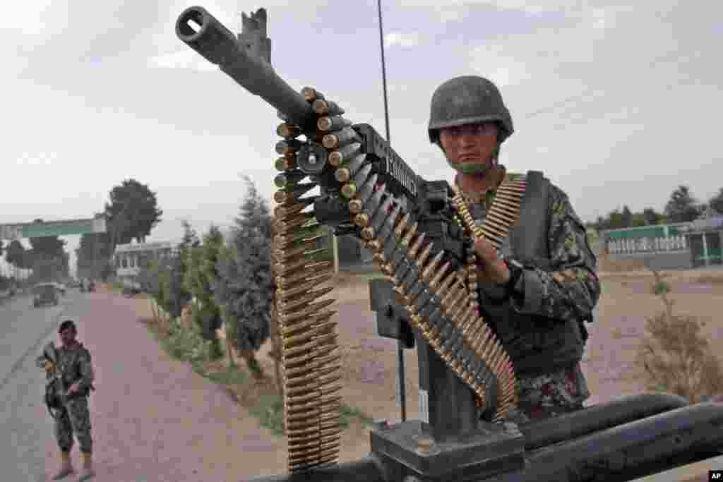 With fears for violence high during the presidential election, Afghanistan National Army soldiers stand alert, in Herat, west of Kabul, Afghanistan, June 13, 2014. &nbsp;