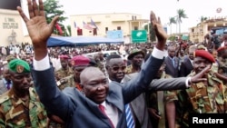 Central African Republic's new leader Michel Djotodia greets supporters at a Seleka rebel alliance rally, downtown Bangui, March 30, 2013.