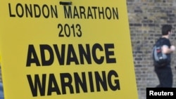 A road closure sign is seen placed along The Mall, the location for the London Marathon finish line, in central London April 16, 2013. 