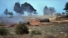 FILE - Turkish artillery fire from the border toward northern Syria, in Kilis, Turkey, Feb. 16, 2016.
