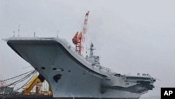China's first aircraft carrier is seen at its shipyard at Dalian Port in northeast China's Liaoning province, in this still image taken from a July 27, 2011