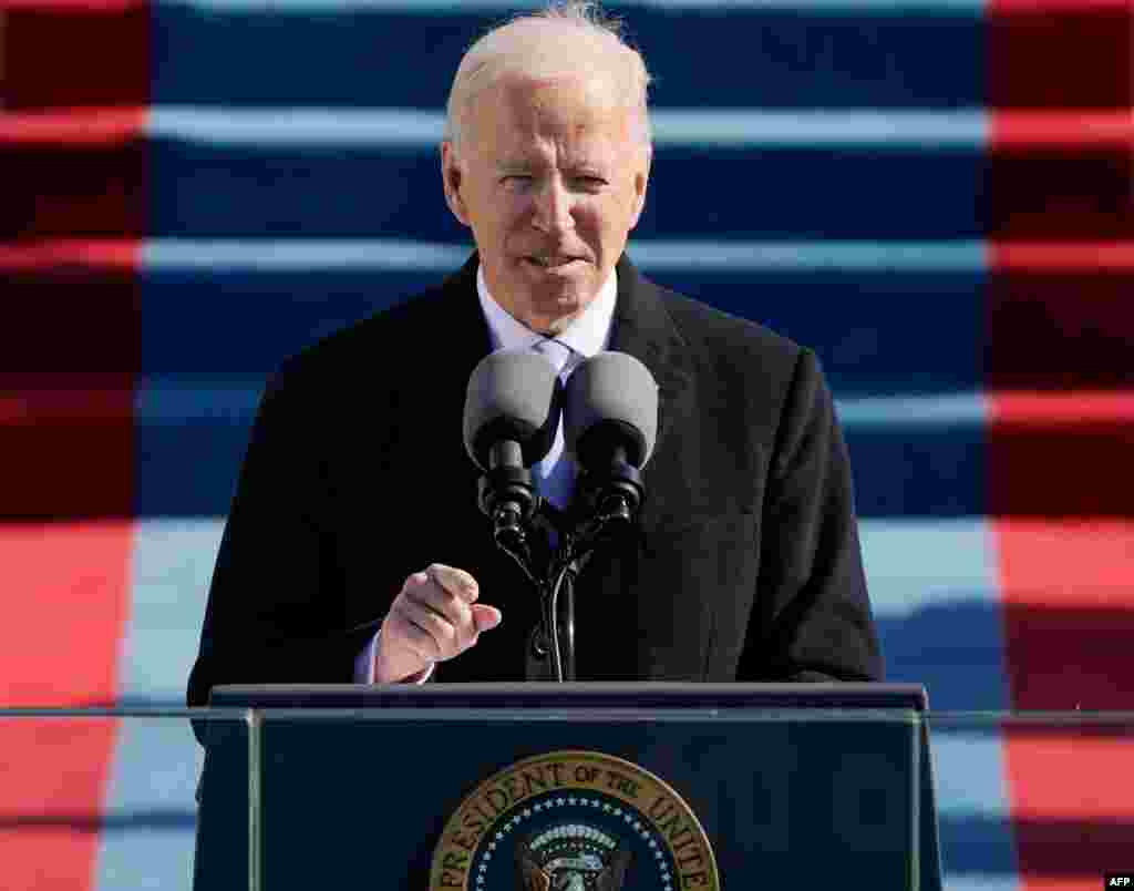 Joe Biden delivers a speech after being sworn in as the 46th president of the United States during the 59th Presidential Inauguration at the US Capitol in Washington DC on January 20, 2021. (Photo by Patrick Semansky / POOL / AFP)