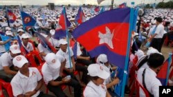 In this July 7, 2018, file photo, supporters wait for the start of a campaign rally of Cambodian Prime Minister Hun Sen's Cambodian People's Party in Phnom Penh, Cambodia. (AP Photo/Heng Sinith, File)