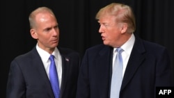 March 14, 2018, President Donald Trump speaks with Boeing CEO Dennis Muilenburg 