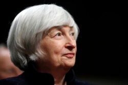 FILE - Federal Reserve Chair Janet Yellen listens to introductions as she is awarded the Paul H. Douglas Award for Ethics in Government, on Capitol Hill in Washington, Nov. 7, 2017.