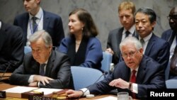 U.S. Secretary of State Rex Tillerson (R) speaks next to U.N. Secretary-General Antonio Guterres during a Security Council meeting on the situation in North Korea at the United Nations (U.N.) in New York, April 28, 2017.