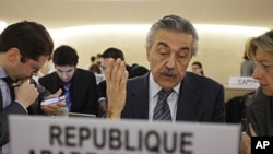 Syria's Ambassador Faysal Khabbaz Hamoui (C) gestures during a Human Rights Council special session on the situation in Syria at the United Nations in Geneva, December 2, 2011.