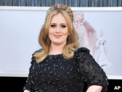 FILE - Adele arrives at the Oscars in Los Angeles.