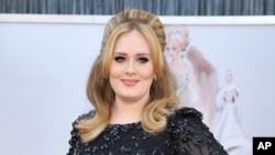 FILE - Adele arrives at the Oscars in Los Angeles.