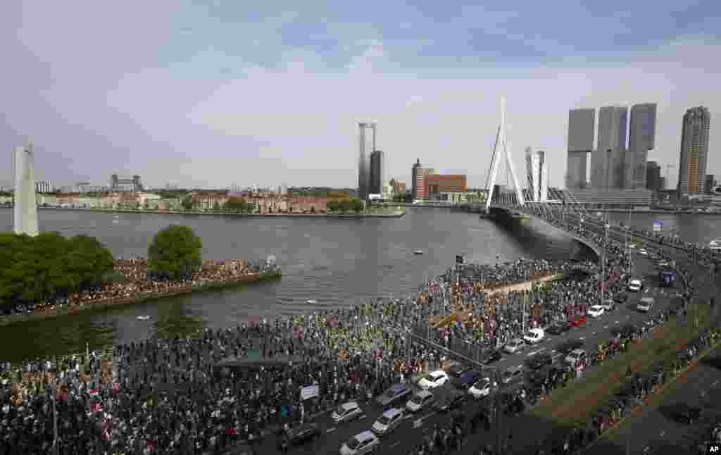 Thousands of people line Erasmus bridge as they take part in a demonstration in Rotterdam, Netherlands, to protest against the recent killing of George Floyd, police violence and institutionalized racism.