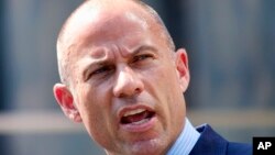 FILE - Michael Avenatti, the attorney for porn actress Stormy Daniels, talks to the media during a news conference in front of the U.S. Federal Courthouse in Los Angeles, July 27, 2018.