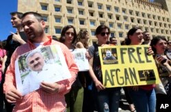 FILE - Journalists attend a rally Tbilisi, Georgia, May 31, 2017, to support Azerbaijani journalist Afgan Mukhtarli, who was abducted in Tbilisi on May 29 and then detained in the Azerbaijan capital, Baku. He remains in prison.