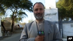 VOA reporter Mukarram Khan Aatif shown in northwest Pakistan in January 2012.