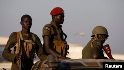 South Sudan army soldiers are seen standing in a vehicle in Juba Dec. 20, 2013.