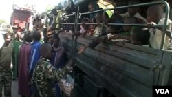 Nigerian refugees are seen on a Cameroonian military truck set to make its way out of Fotokol for Nigeria, in Fotokol, Cameroon, April 19, 2017. (M.E. Kindzeka/VOA)