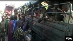 FILE - Nigerian refugees are seen on a Cameroonian military truck set to make its way out of Fotokol for Nigeria, in Fotokol, Cameroon, April 19, 2017. (M.E. Kindzeka/VOA)